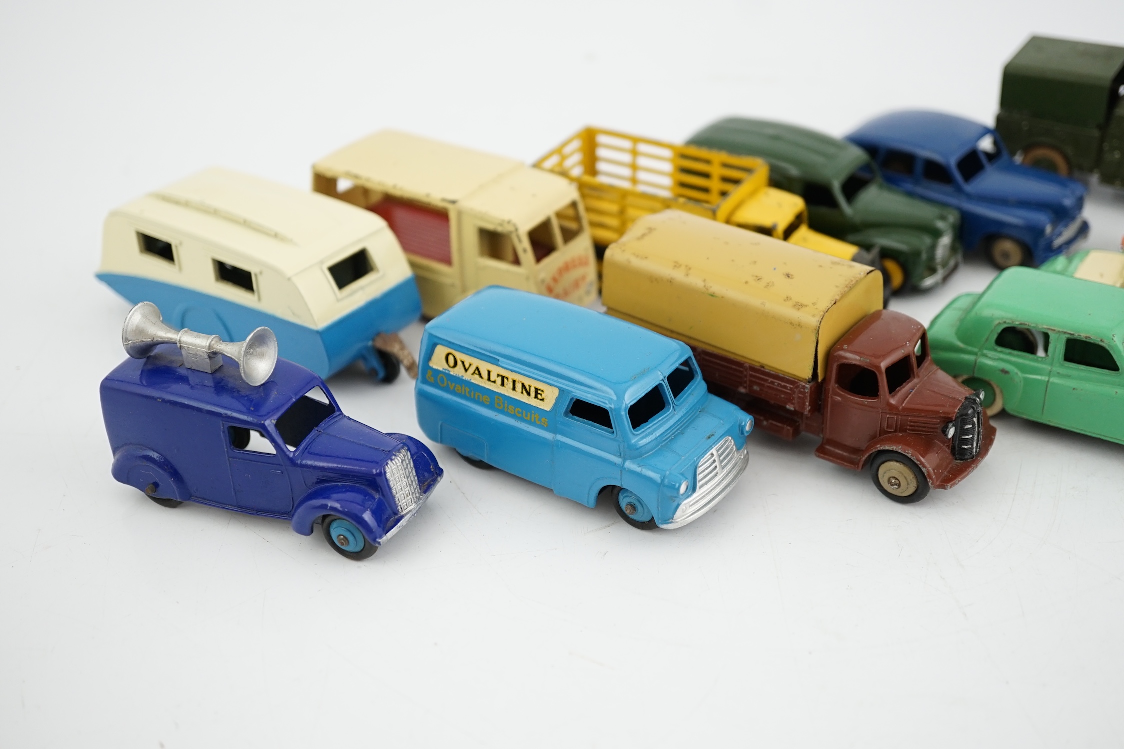 Twelve Dinky Toys, including; Austin van, Vanguard, Market Gardener’s wagon, Hillman Minx, MG Midget, Bedford van, etc.